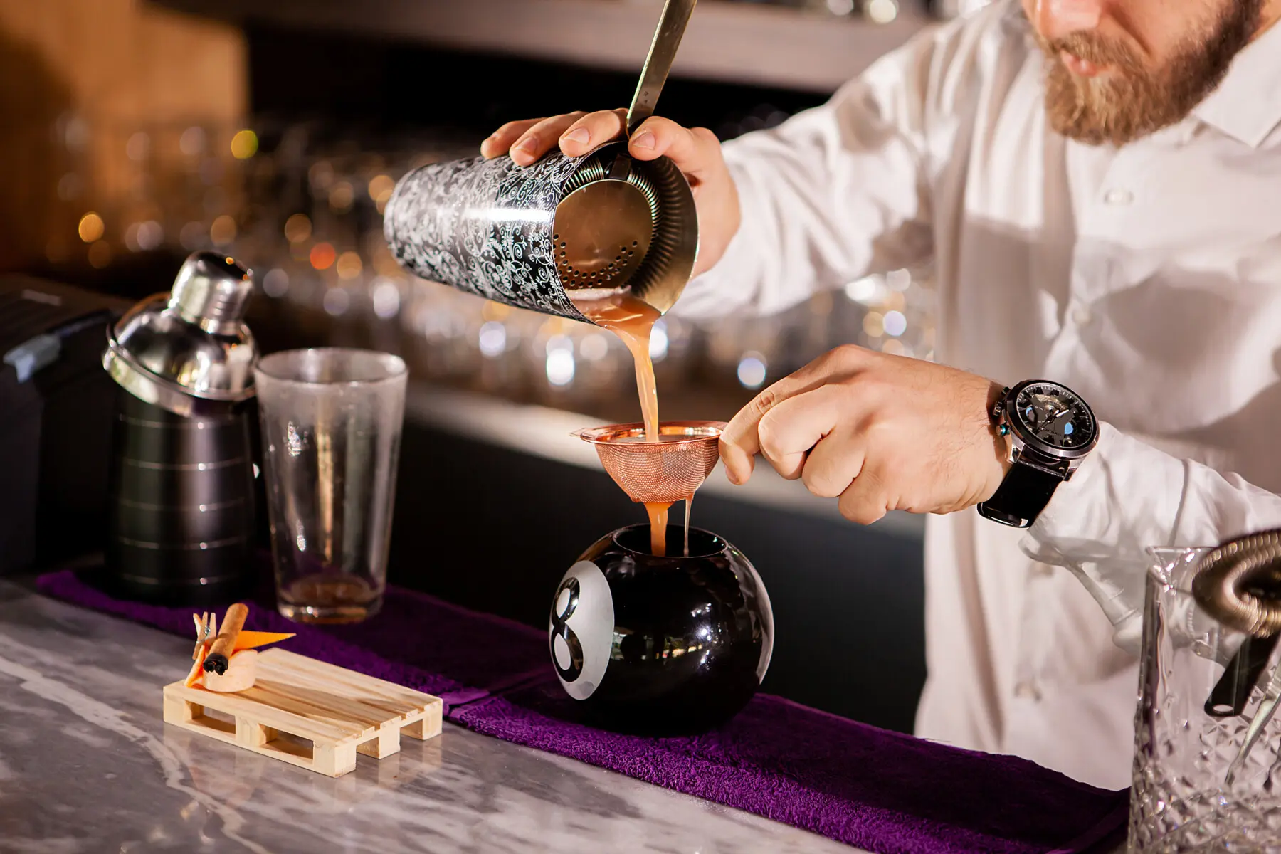 Bartender bartender is pouring a drink